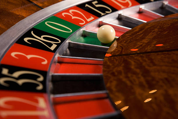 Live baccarat table with professional dealer and side-view camera angle
